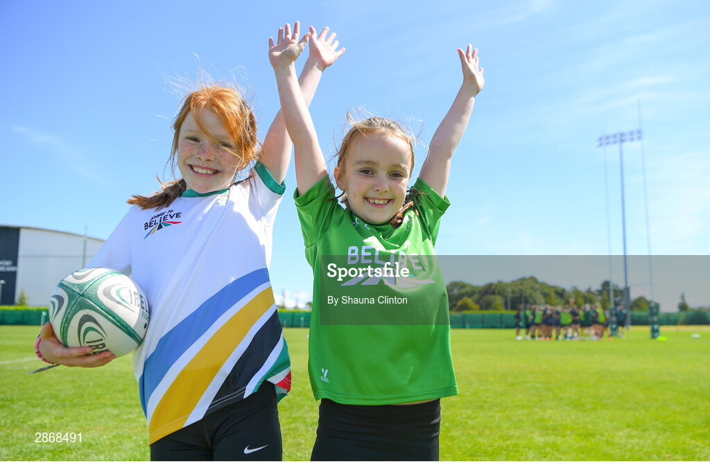 8 July 2024; Ireland supporters Niamh, left, and Ciara Jones, both aged 9, from Dublin, during the Team Ireland Paris 2024 team training for Rugby Sevens ahead of the Paris 2024 Olympic Games at the IRFU Outdoor Pitch on the Sport Ireland Campus in Dublin. Photo by Shauna Clinton/Sportsfile