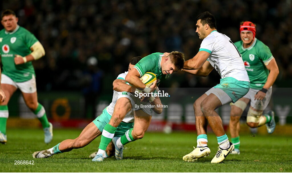 6 July 2024; Jack Crowley of Ireland is tackled by Jesse Kriel and Damian de Allende of South Africa during the first test between South Africa and Ireland at Loftus Versfeld Stadium in Pretoria, South Africa. Photo by Brendan Moran/Sportsfile