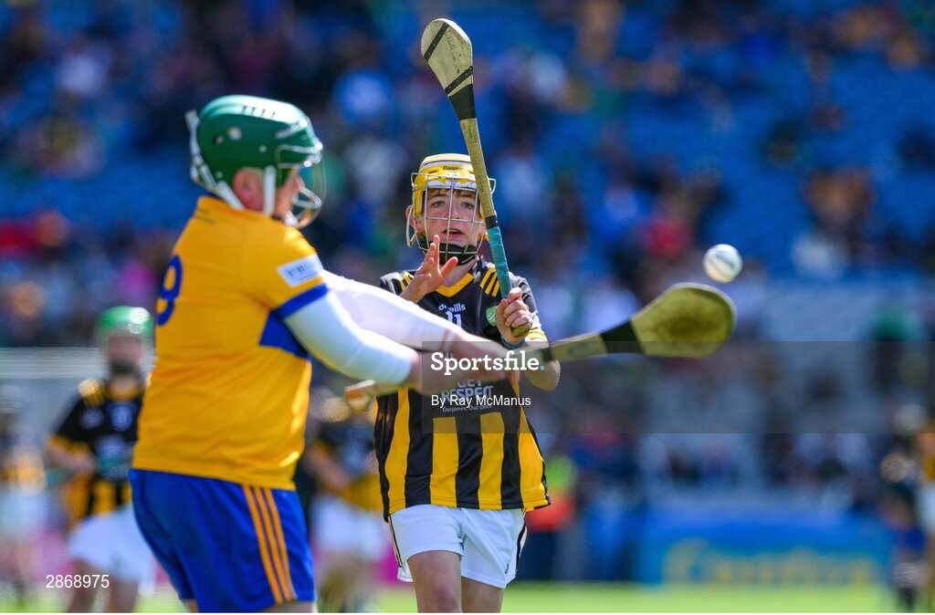 6 July 2024; Goalkeeper Danny Kerry, Holy Family Senior School, Portlaoise, Laois, representing Clare clears under pressure from Harry Brennan, St Aidan's NS, Kilmanagh, Kilkenny, representing Kilkenny during the GAA INTO Cumann na mBunscol Respect Exhibition Go Games at the GAA Hurling All-Ireland Senior Championship semi-final match between Kilkenny and Clare at Croke Park in Dublin. Photo by Ray McManus/Sportsfile