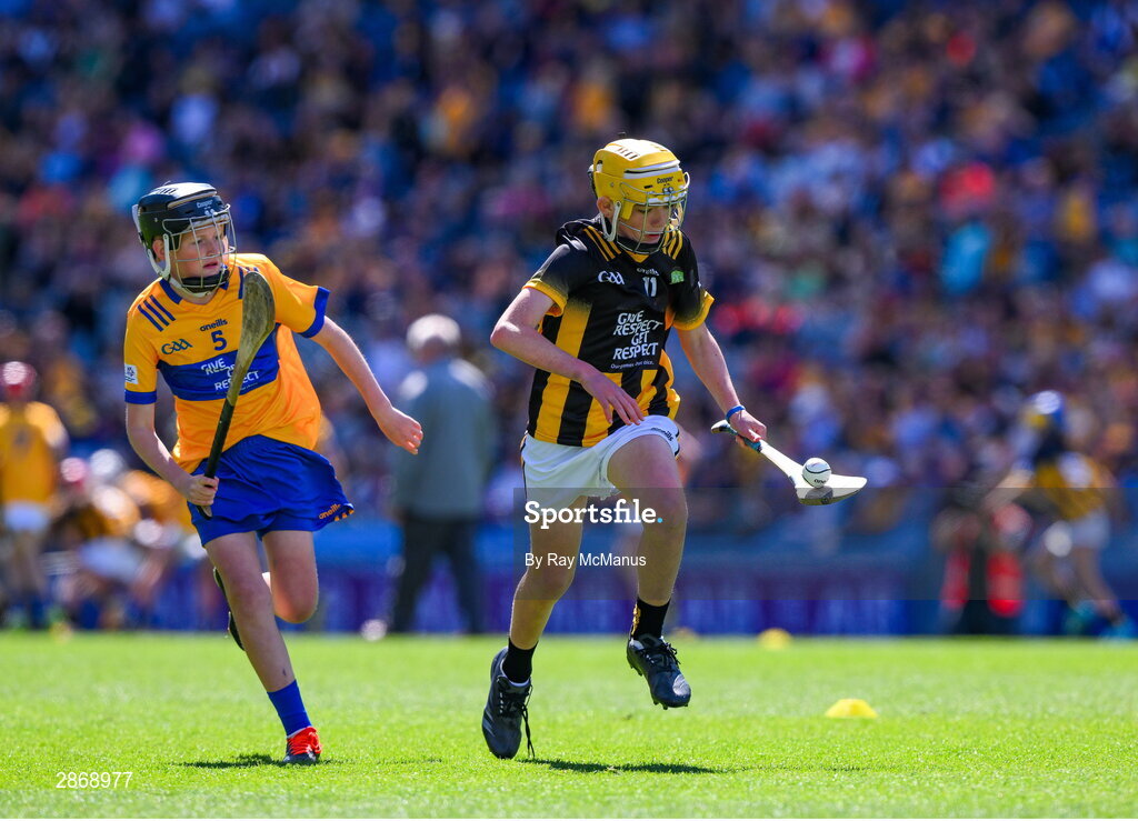 6 July 2024; Harry Brennan, St Aidan's NS, Kilmanagh, Kilkenny, representing Kilkenny in action against Cillian Casey, Toreen NS, Mayo, representing Clare during the GAA INTO Cumann na mBunscol Respect Exhibition Go Games at the GAA Hurling All-Ireland Senior Championship semi-final match between Kilkenny and Clare at Croke Park in Dublin. Photo by Ray McManus/Sportsfile