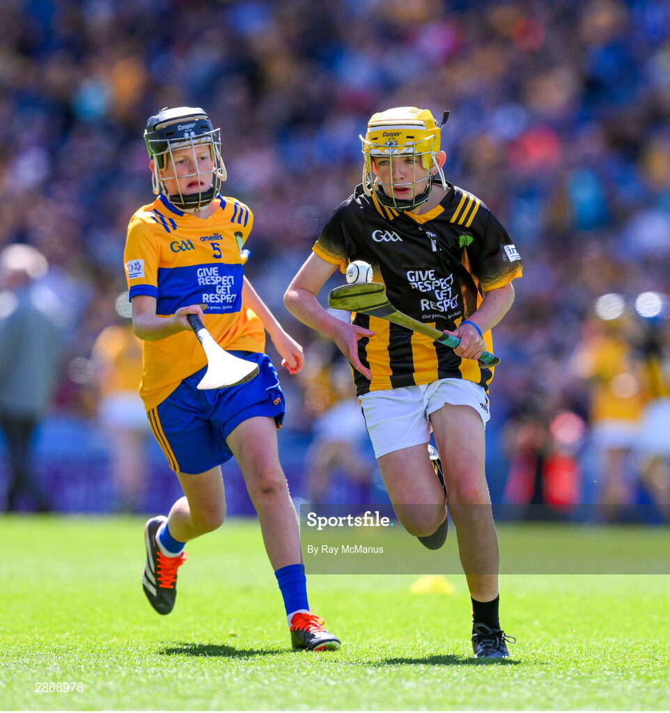 6 July 2024; Harry Brennan, St Aidan's NS, Kilmanagh, Kilkenny, representing Kilkenny in action against Cillian Casey, Toreen NS, Mayo, representing Clare during the GAA INTO Cumann na mBunscol Respect Exhibition Go Games at the GAA Hurling All-Ireland Senior Championship semi-final match between Kilkenny and Clare at Croke Park in Dublin. Photo by Ray McManus/Sportsfile