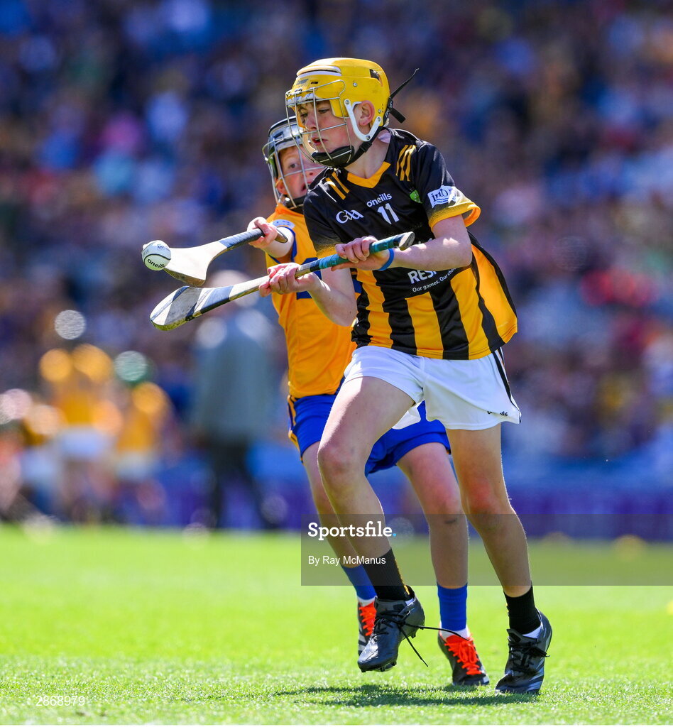 6 July 2024; Harry Brennan, St Aidan's NS, Kilmanagh, Kilkenny, representing Kilkenny in action against Cillian Casey, Toreen NS, Mayo, representing Clare during the GAA INTO Cumann na mBunscol Respect Exhibition Go Games at the GAA Hurling All-Ireland Senior Championship semi-final match between Kilkenny and Clare at Croke Park in Dublin. Photo by Ray McManus/Sportsfile