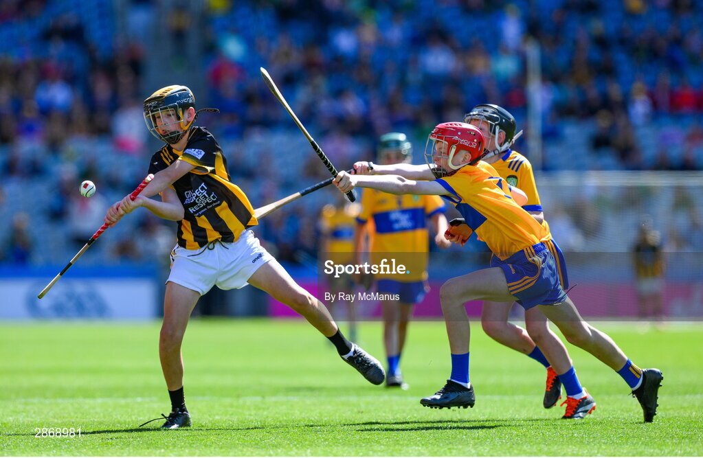 6 July 2024; Mark Phelan, Scoil Mhuire, Gowran, Kilkenny, representing Kilkenny is tackled by John Bloomer, St Brendan's NS, Portumna, Galway, representing Clare and Cillian Casey, Toreen NS, Mayo, representing Clare during the GAA INTO Cumann na mBunscol Respect Exhibition Go Games at the GAA Hurling All-Ireland Senior Championship semi-final match between Kilkenny and Clare at Croke Park in Dublin. Photo by Ray McManus/Sportsfile