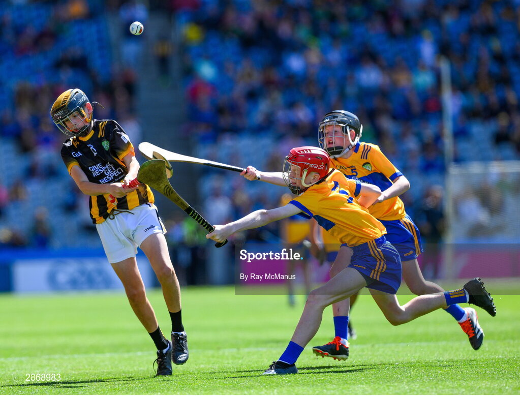 6 July 2024; Mark Phelan, Scoil Mhuire, Gowran, Kilkenny, representing Kilkenny is tackled by John Bloomer, St Brendan's NS, Portumna, Galway, representing Clare and Cillian Casey, Toreen NS, Mayo, representing Clare during the GAA INTO Cumann na mBunscol Respect Exhibition Go Games at the GAA Hurling All-Ireland Senior Championship semi-final match between Kilkenny and Clare at Croke Park in Dublin. Photo by Ray McManus/Sportsfile