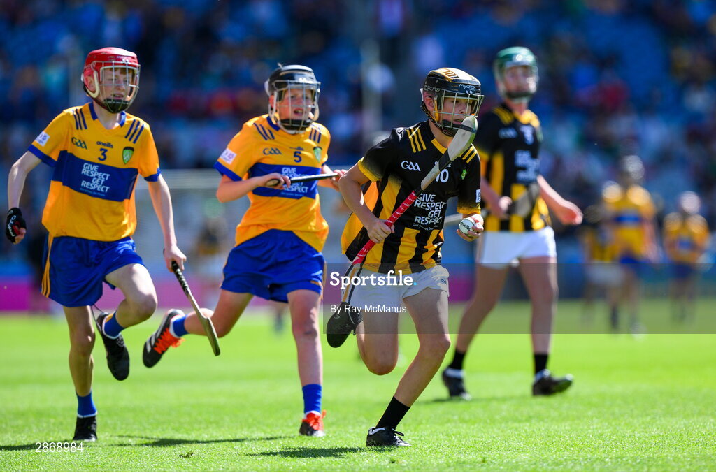 6 July 2024; Mark Phelan, Scoil Mhuire, Gowran, Kilkenny, representing Kilkenny in action against John Bloomer, St Brendan's NS, Portumna, Galway, representing Clare and Cillian Casey, Toreen NS, Mayo, representing Clare during the GAA INTO Cumann na mBunscol Respect Exhibition Go Games at the GAA Hurling All-Ireland Senior Championship semi-final match between Kilkenny and Clare at Croke Park in Dublin. Photo by Ray McManus/Sportsfile
