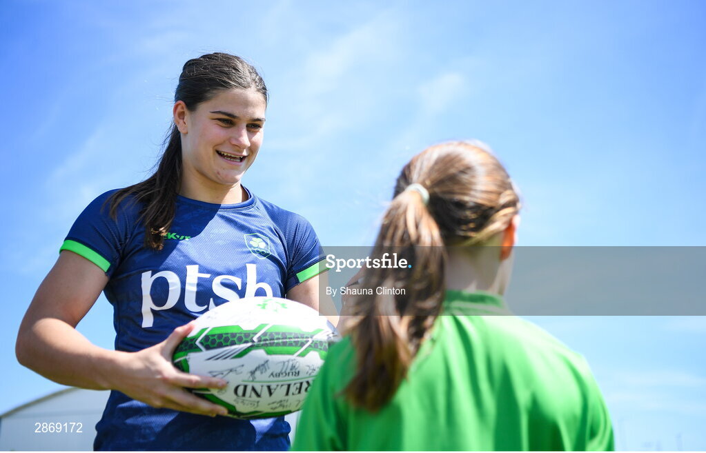 8 July 2024; Vicky Elmes Kinlan signs a ball for a supporter during the Team Ireland Paris 2024 team training for Rugby Sevens ahead of the Paris 2024 Olympic Games at the IRFU Outdoor Pitch on the Sport Ireland Campus in Dublin. Photo by Shauna Clinton/Sportsfile