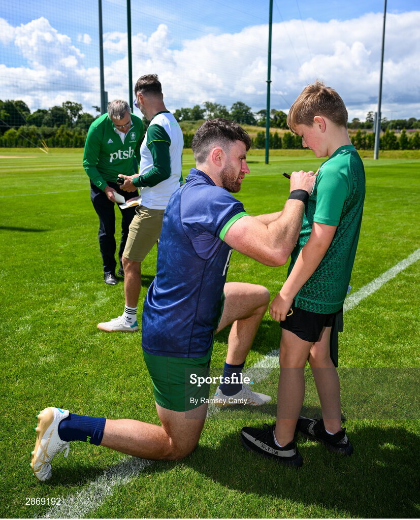 8 July 2024; Hugo Keenan signs autographs during the Team Ireland Paris 2024 team training for Rugby Sevens ahead of the Paris 2024 Olympic Games at the IRFU Outdoor Pitch on the Sport Ireland Campus in Dublin. Photo by Ramsey Cardy/Sportsfile