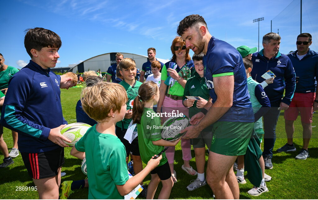 8 July 2024; Hugo Keenan signs autographs during the Team Ireland Paris 2024 team training for Rugby Sevens ahead of the Paris 2024 Olympic Games at the IRFU Outdoor Pitch on the Sport Ireland Campus in Dublin. Photo by Ramsey Cardy/Sportsfile