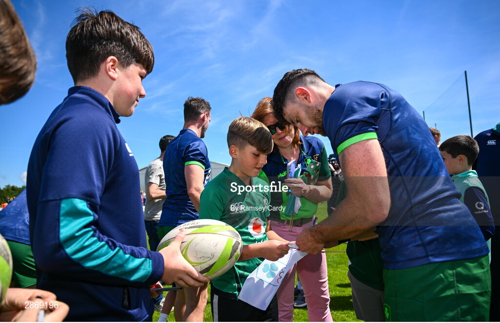 8 July 2024; Hugo Keenan signs autographs during the Team Ireland Paris 2024 team training for Rugby Sevens ahead of the Paris 2024 Olympic Games at the IRFU Outdoor Pitch on the Sport Ireland Campus in Dublin. Photo by Ramsey Cardy/Sportsfile