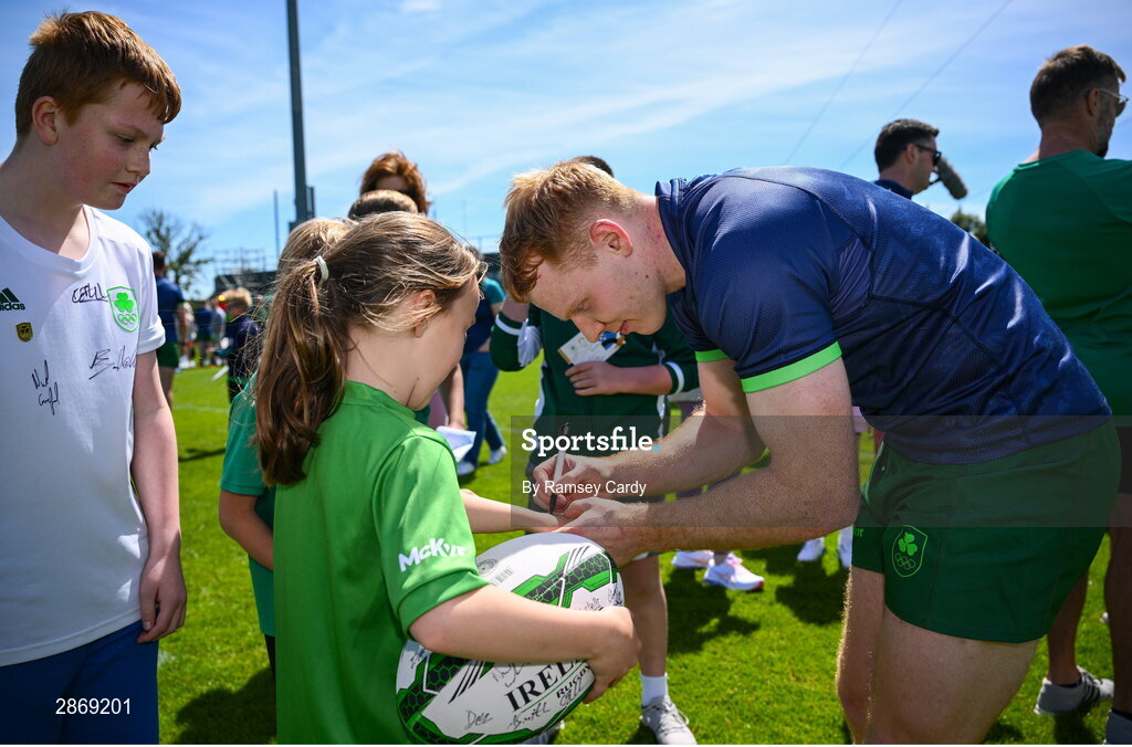 8 July 2024; Gavin Mullin signs autographs during the Team Ireland Paris 2024 team training for Rugby Sevens ahead of the Paris 2024 Olympic Games at the IRFU Outdoor Pitch on the Sport Ireland Campus in Dublin. Photo by Ramsey Cardy/Sportsfile