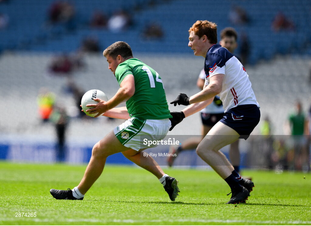 14 July 2024; Seán Hickey of London is tackled by Paidí Mathers of New York during the GAA Football All-Ireland Junior Championship final between London and New York at Croke Park in Dublin. Photo by Ray McManus/Sportsfile