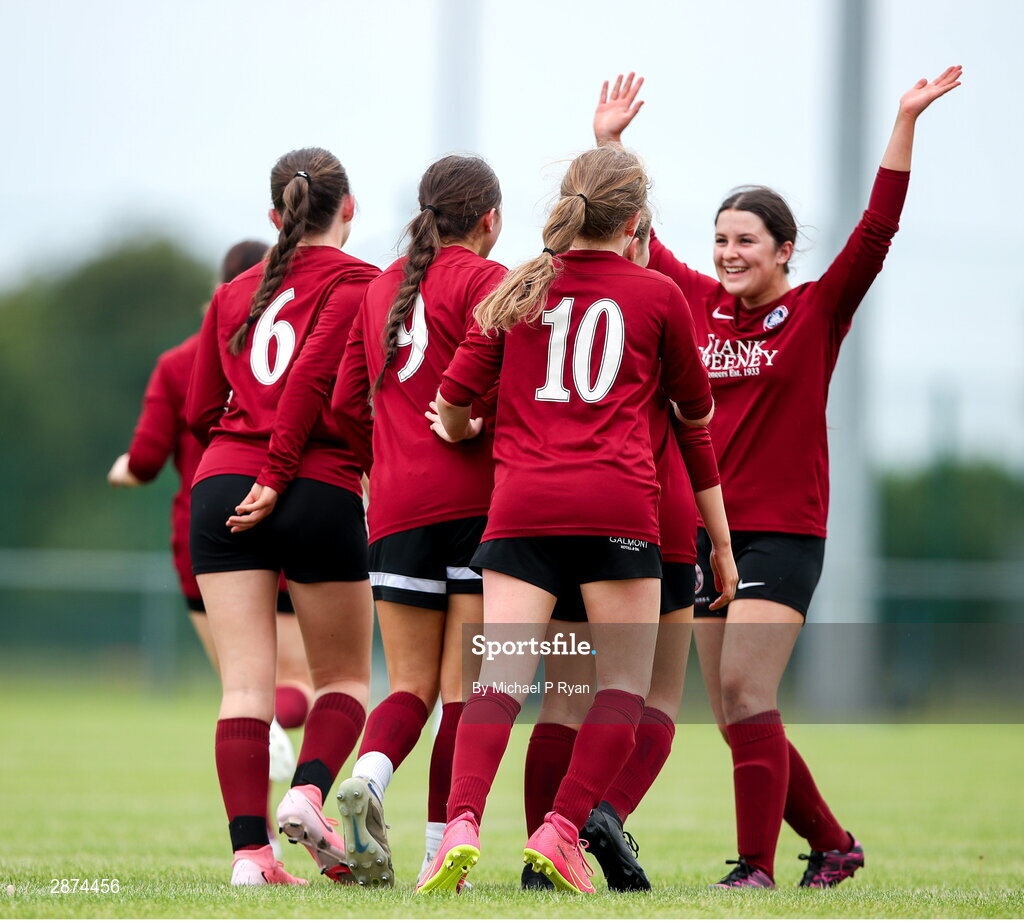 14 July 2024; Kerri O'Driscoll of Athenry, 9, is congratulated by teamamtes after scoring her sides first goal during the FAI Women's Under 17 Cup final match between Athenry and Killester Donnycarney FC at Mullingar Athletic FC in Gainstown, Westmeath. Photo by Michael P Ryan/Sportsfile