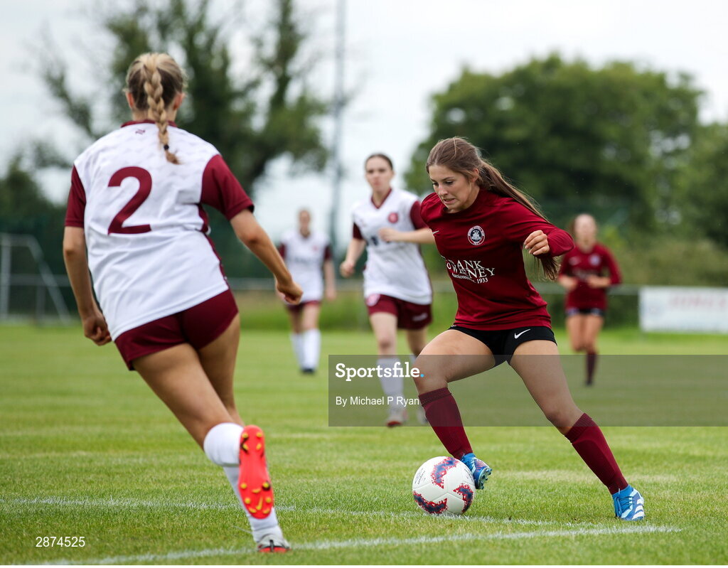 14 July 2024; Mollie Noone of Athenry in action against Sienna Heary of Killester Donnycarney FC during the FAI Women's Under 17 Cup final match between Athenry and Killester Donnycarney FC at Mullingar Athletic FC in Gainstown, Westmeath. Photo by Michael P Ryan/Sportsfile