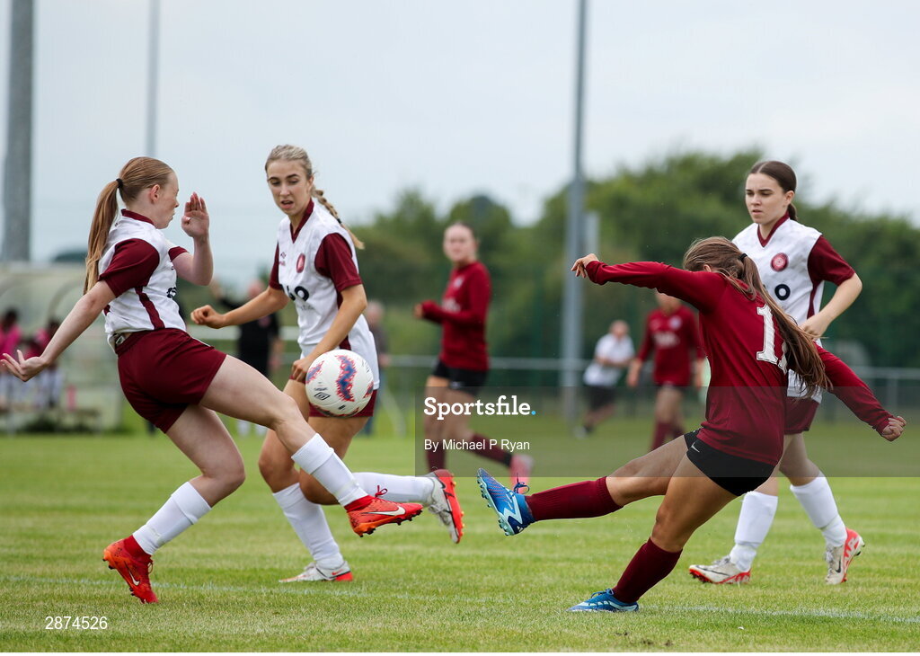 14 July 2024; Mollie Noone of Athenry has a shot on goal blocked by Drew Hendrick of Killester Donnycarney FC during the FAI Women's Under 17 Cup final match between Athenry and Killester Donnycarney FC at Mullingar Athletic FC in Gainstown, Westmeath. Photo by Michael P Ryan/Sportsfile