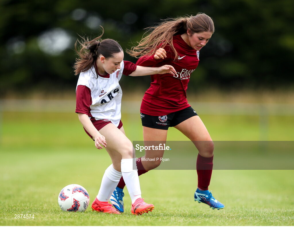 14 July 2024; Ava O'Brien of Killester Donnycarney FC in action against Mollie Noone of Athenry during the FAI Women's Under 17 Cup final match between Athenry and Killester Donnycarney FC at Mullingar Athletic FC in Gainstown, Westmeath. Photo by Michael P Ryan/Sportsfile
