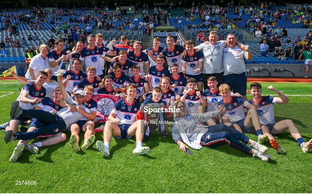 14 July 2024; Dylan Curran of New York , the NY cheerleader Pádraig Doheny and officials celebrate with the cup after the GAA Football All-Ireland Junior Championship final between London and New York at Croke Park in Dublin. Photo by Ray McManus/Sportsfile