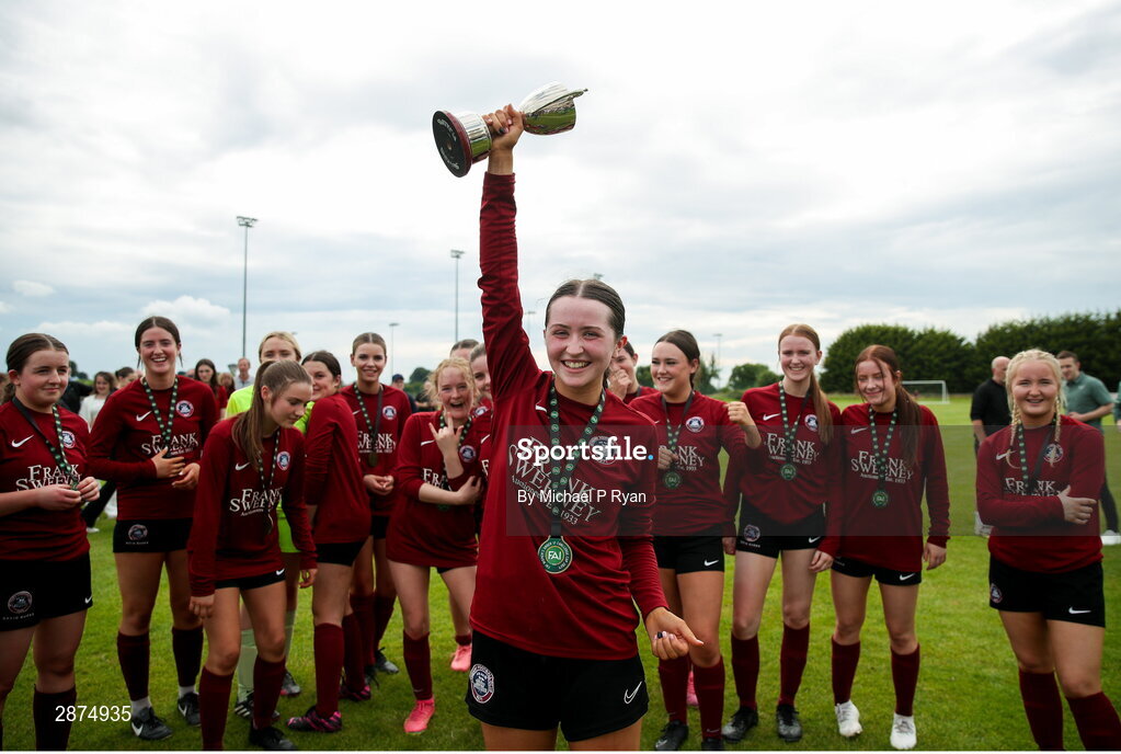 14 July 2024; Athenry captain Kerri O'Driscoll lifts the cup after the FAI Women's Under 17 Cup final match between Athenry and Killester Donnycarney FC at Mullingar Athletic FC in Gainstown, Westmeath. Photo by Michael P Ryan/Sportsfile