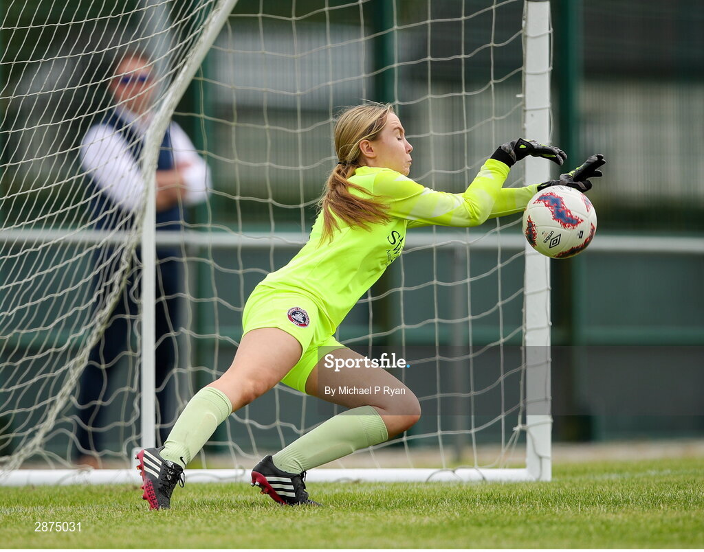 14 July 2024; Athenry goalkeeper Mollie Gilligan saves a penalty from Drew Hendrick of Killester Donnycarney FC during the FAI Women's Under 17 Cup final match between Athenry and Killester Donnycarney FC at Mullingar Athletic FC in Gainstown, Westmeath. Photo by Michael P Ryan/Sportsfile