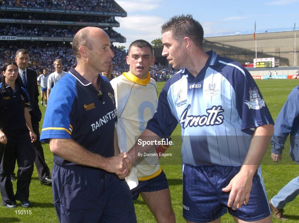 1 August 2004; Roscommon manager Tommy Carr shakes hands with Dublin's Jonathan Magee as team-mate Paul Casey looks on. Bank of Ireland All-Ireland Football Championship, Round 4, Dublin v Roscommon, Croke Park, Dublin. Picture credit; Damien Eagers / SPORTSFILE