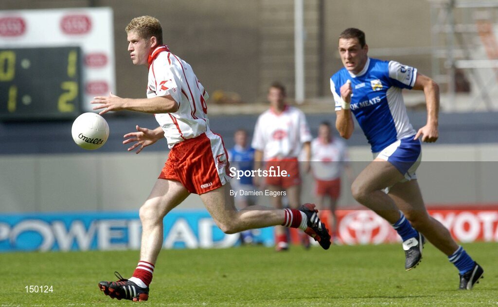 1 August 2004; Kevin Hughes, Tyrone, in action against Darren Rooney, Laois. Bank of Ireland All-Ireland Football Championship, Round 4, Laois v Tyrone, Croke Park, Dublin. Picture credit; Damien Eagers / SPORTSFILE