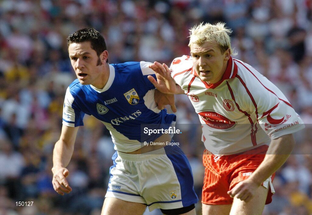 1 August 2004; Eoin Mulligan, Tyrone, races for possession with Cathal Ryan, Laois. Bank of Ireland All-Ireland Football Championship, Round 4, Laois v Tyrone, Croke Park, Dublin. Picture credit; Damien Eagers / SPORTSFILE