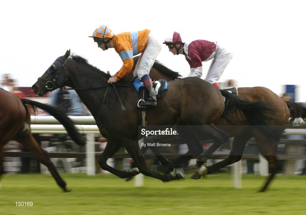 27 July 2004; Boundary,orange silks, with Pat Scallan up, during the McDonagh Builders Trade Centre Handicap also pictured is the eventual winner Loyal with Fran Berry, far side,. Galway Races, Ballybrit, Co. Galway. Picture credit; Matt Browne / SPORTSFILE