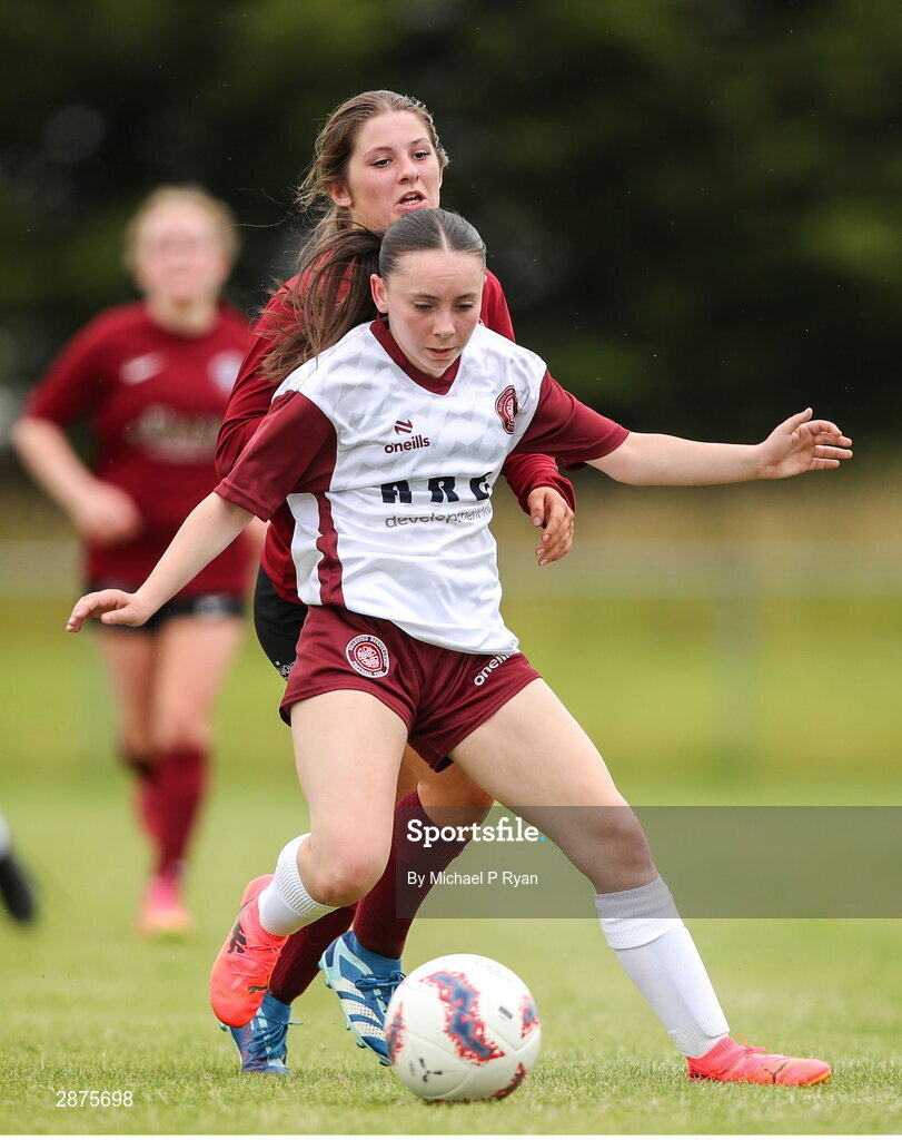 14 July 2024; Ava O'Brien of Killester Donnycarney FC in action against Mollie Noone of Athenry during the FAI Women's Under 17 Cup final match between Athenry and Killester Donnycarney FC at Mullingar Athletic FC in Gainstown, Westmeath. Photo by Michael P Ryan/Sportsfile