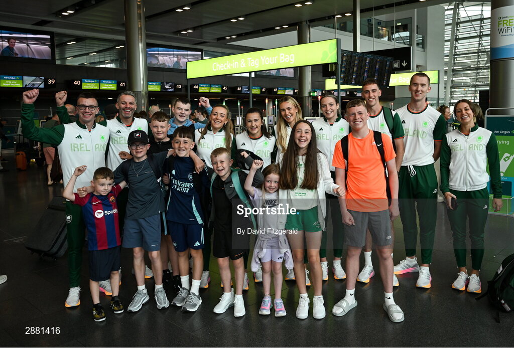 19 July 2024; Athletes, from left, Chris O'Donnell, Thomas Barr, Lauren Cadden, Phil Healy, Sharlene Mawdsley, Rachel McCann, Cathal Doyle, Jack Raftery and Sophie Becker with fans at Dublin Airport as members of Team Ireland Depart for the 2024 Paris Olympic Games. Photo by David Fitzgerald/Sportsfile