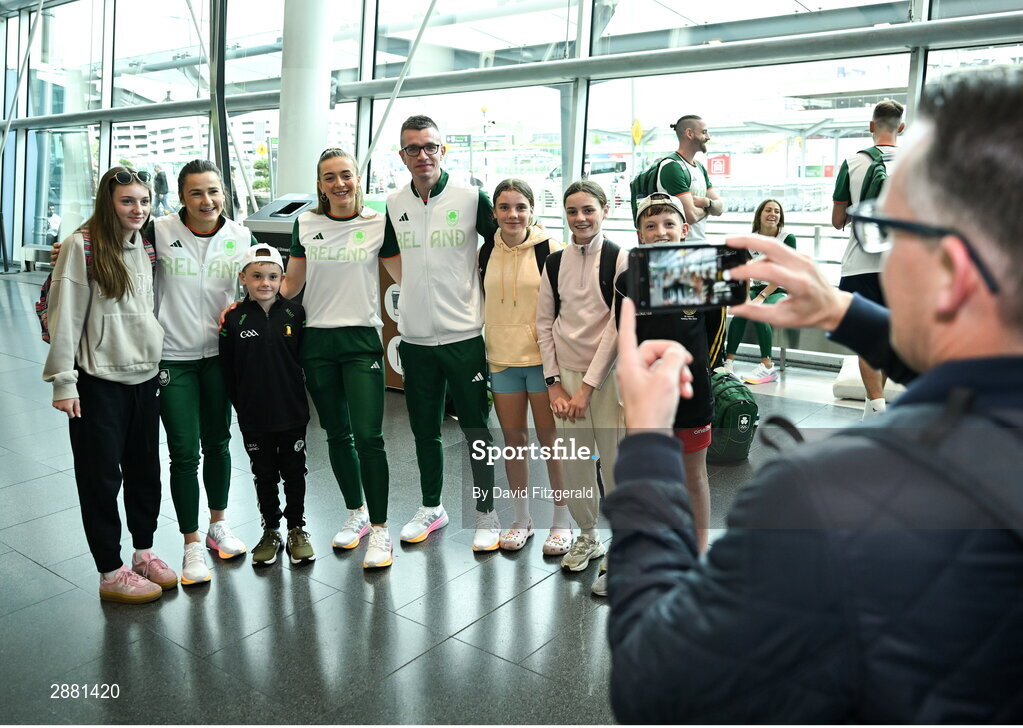 19 July 2024; Athletes Phil Healy, Lauren Cadden and Chris O'Donnell with young fans at Dublin Airport as members of Team Ireland Depart for the 2024 Paris Olympic Games. Photo by David Fitzgerald/Sportsfile