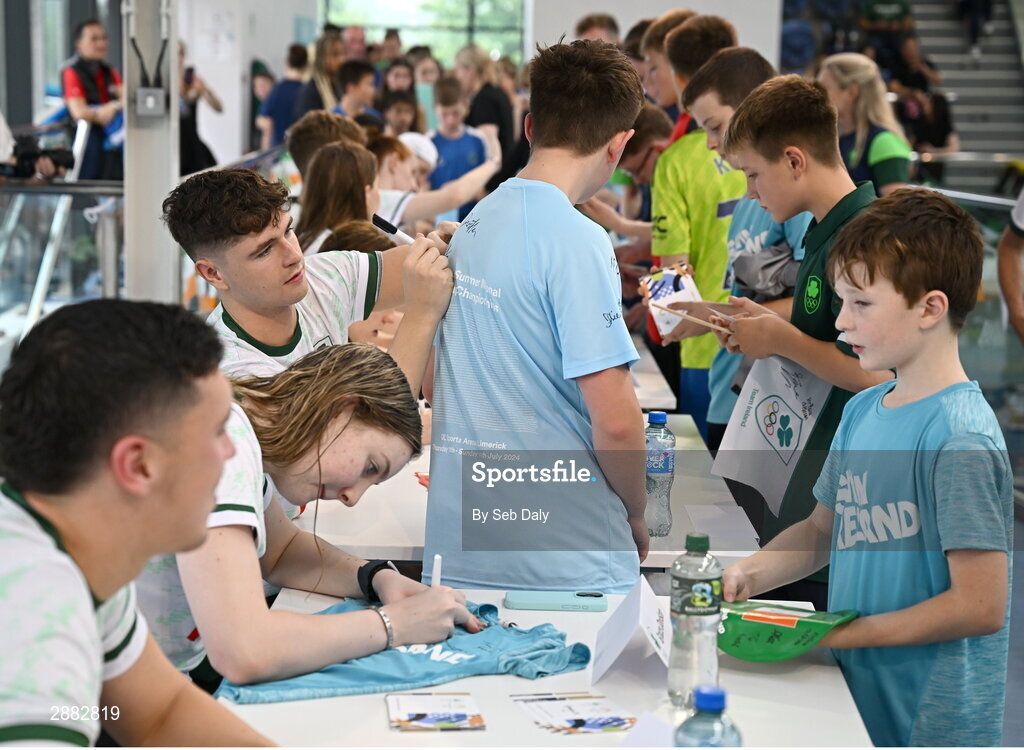 20 July 2024; Grace Davison signs her autograph for a young supporter during a Team Ireland Paris 2024 Aquatics team training session at the National Aquatic Centre on the Sport Ireland Campus in Dublin. Photo by Seb Daly/Sportsfile