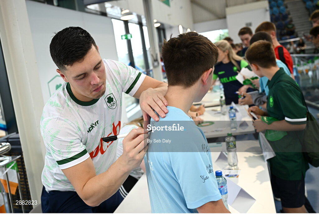 20 July 2024; Darragh Greene signs his autograph for a young supporter during a Team Ireland Paris 2024 Aquatics team training session at the National Aquatic Centre on the Sport Ireland Campus in Dublin. Photo by Seb Daly/Sportsfile