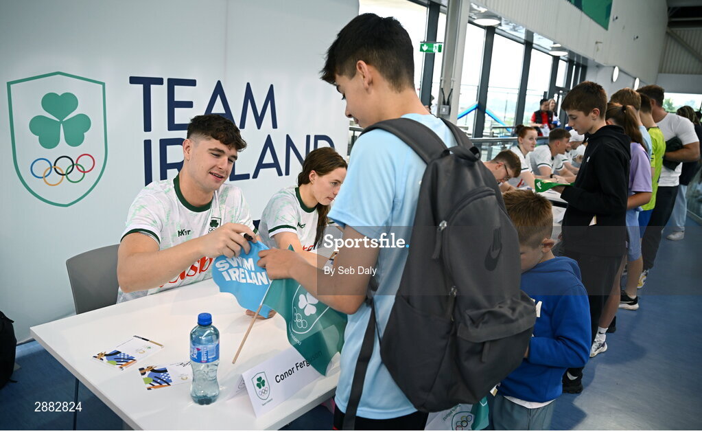 20 July 2024; Conor Ferguson signs his autograph for a young supporter during a Team Ireland Paris 2024 Aquatics team training session at the National Aquatic Centre on the Sport Ireland Campus in Dublin. Photo by Seb Daly/Sportsfile
