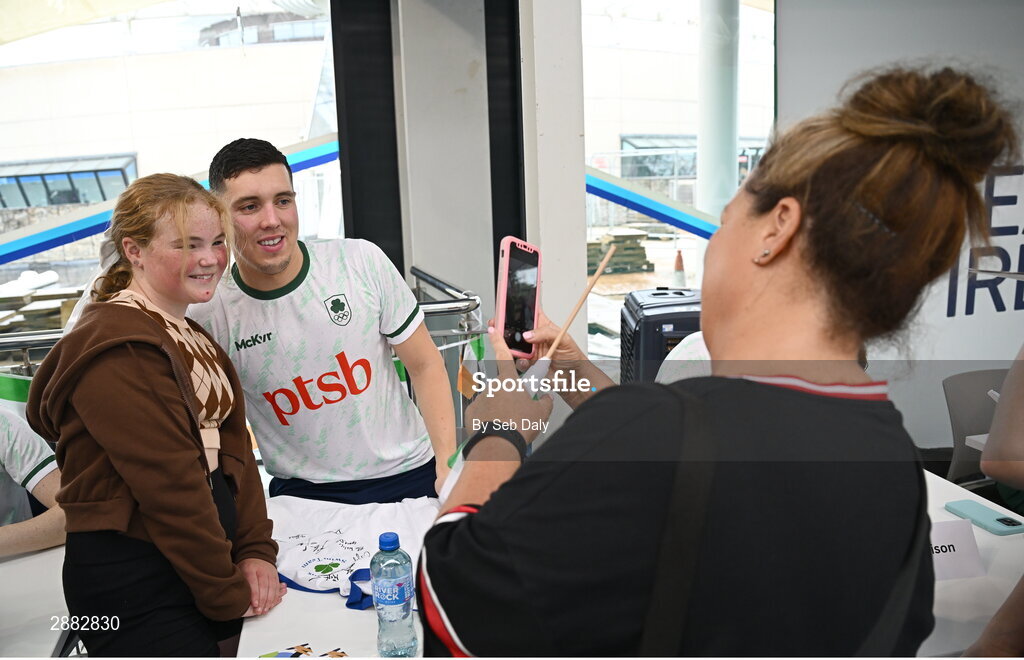 20 July 2024; Darragh Greene takes a photograph with a young supporter during a Team Ireland Paris 2024 Aquatics team training session at the National Aquatic Centre on the Sport Ireland Campus in Dublin. Photo by Seb Daly/Sportsfile