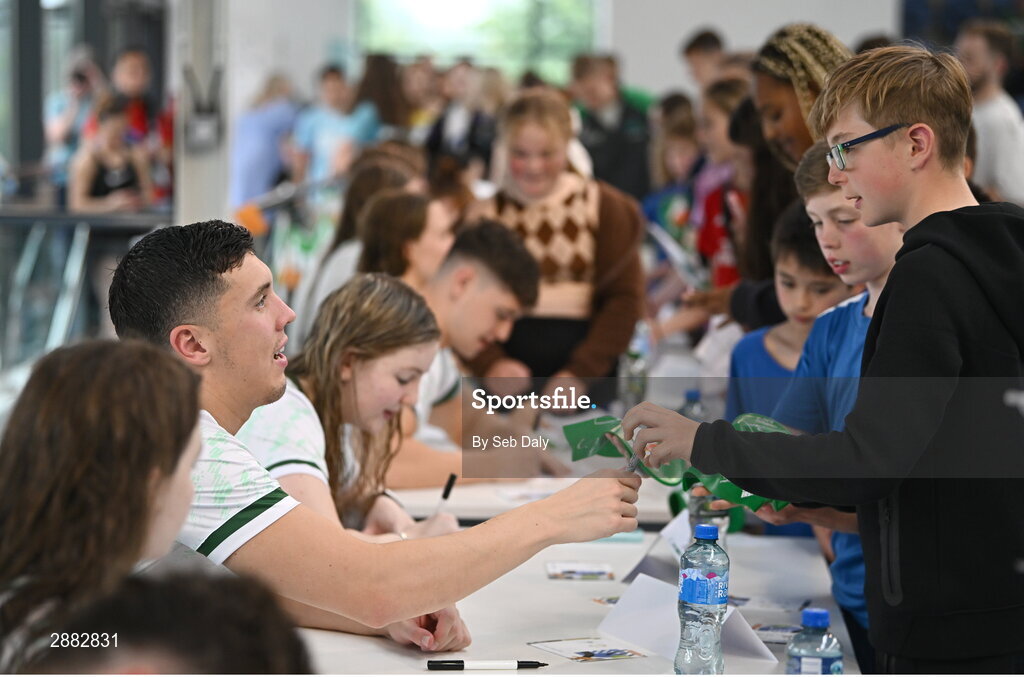 20 July 2024; Darragh Greene signs his autograph for a young supporter during a Team Ireland Paris 2024 Aquatics team training session at the National Aquatic Centre on the Sport Ireland Campus in Dublin. Photo by Seb Daly/Sportsfile