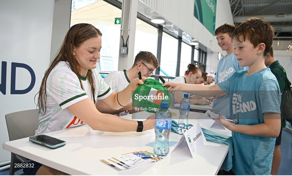 20 July 2024; Mona McSharry signs her autograph for a young supporter during a Team Ireland Paris 2024 Aquatics team training session at the National Aquatic Centre on the Sport Ireland Campus in Dublin. Photo by Seb Daly/Sportsfile