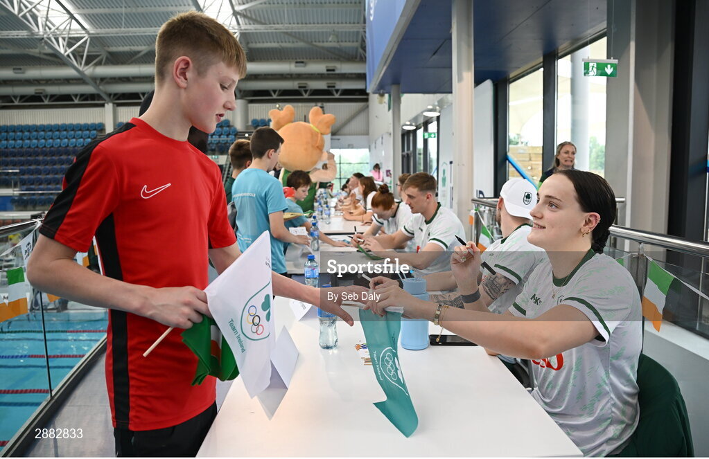 20 July 2024; Victoria Catterson signs her autograph for a young supporter during a Team Ireland Paris 2024 Aquatics team training session at the National Aquatic Centre on the Sport Ireland Campus in Dublin. Photo by Seb Daly/Sportsfile