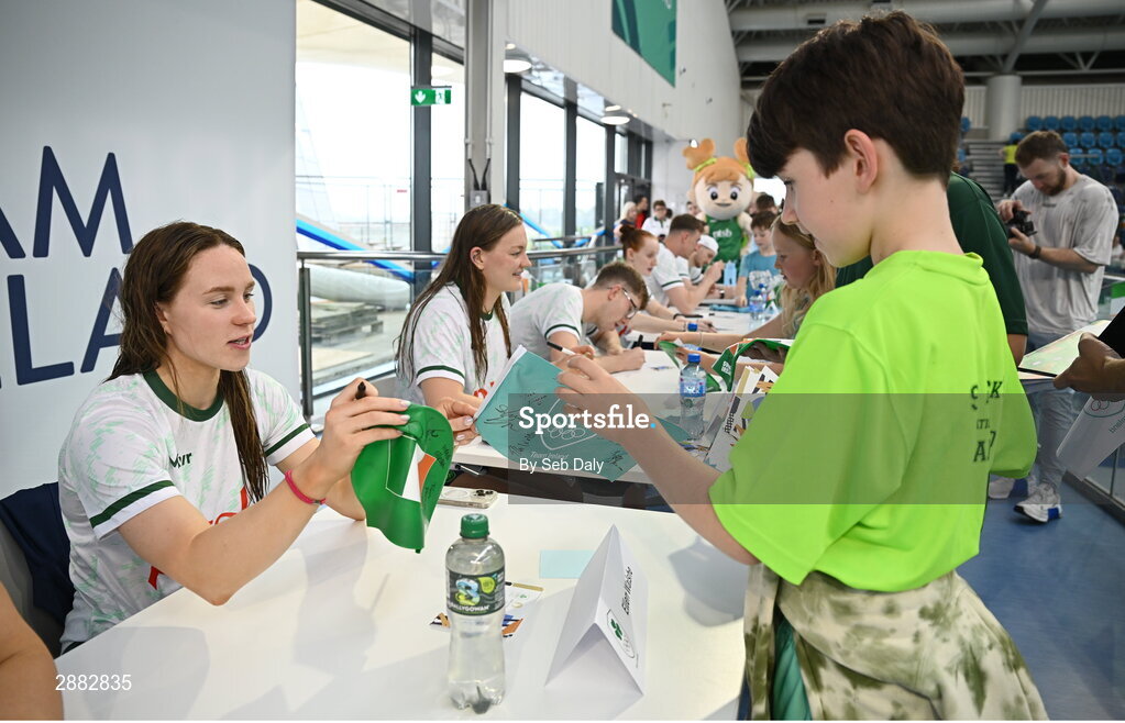 20 July 2024; Ellen Walshe signs her autograph for a young supporter during a Team Ireland Paris 2024 Aquatics team training session at the National Aquatic Centre on the Sport Ireland Campus in Dublin. Photo by Seb Daly/Sportsfile