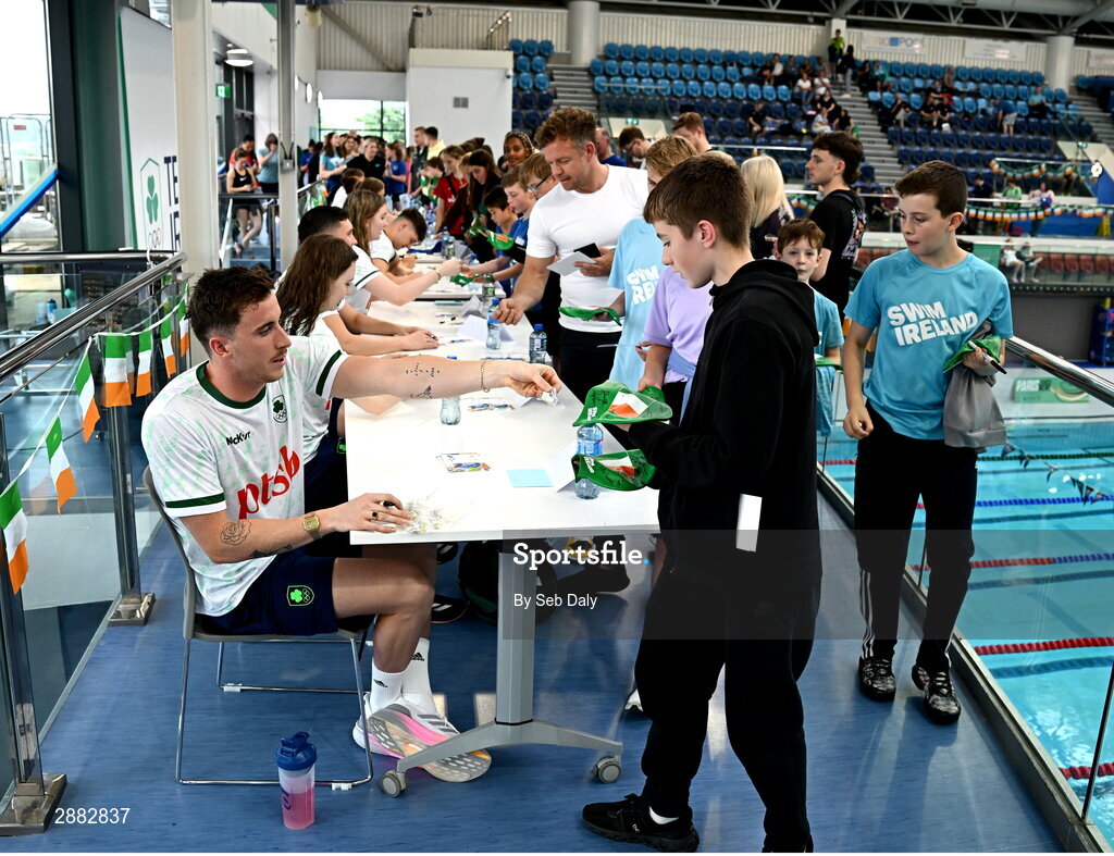 20 July 2024; Max McCusker signs his autograph for a young supporter during a Team Ireland Paris 2024 Aquatics team training session at the National Aquatic Centre on the Sport Ireland Campus in Dublin. Photo by Seb Daly/Sportsfile