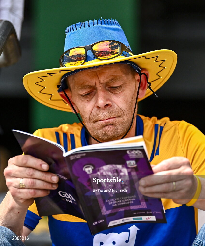 21 July 2024; Clare supporter John O'Malley, from Kilmaley, reads the match programme before the GAA Hurling All-Ireland Senior Championship Final between Clare and Cork at Croke Park in Dublin. Photo by Piaras Ó Mídheach/Sportsfile