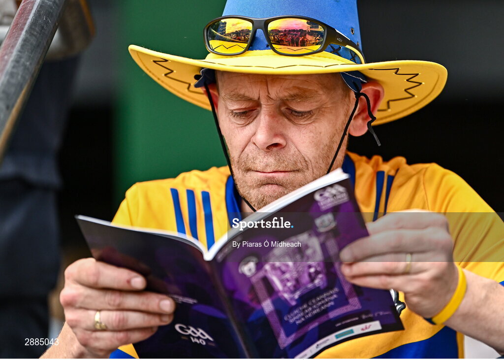 21 July 2024; Clare supporter John O'Malley, from Kilmaley, reads the match programme before the GAA Hurling All-Ireland Senior Championship Final between Clare and Cork at Croke Park in Dublin. Photo by Piaras Ó Mídheach/Sportsfile