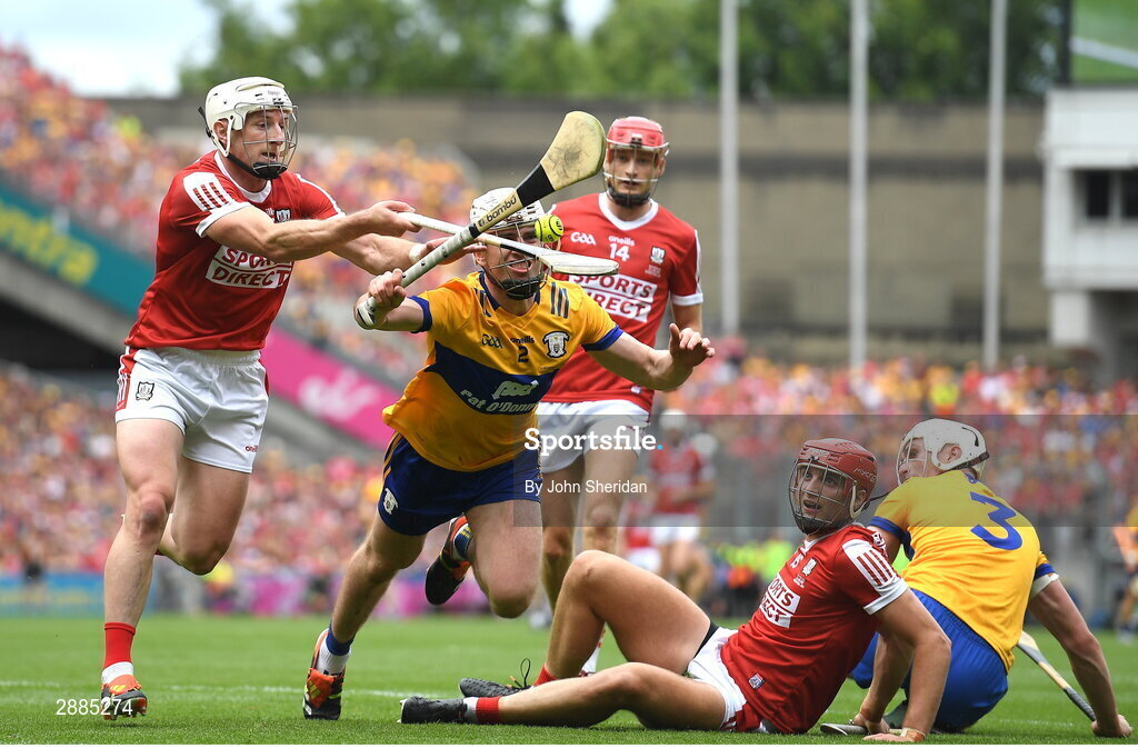 21 July 2024; Patrick Horgan of Cork is tackled by Adam Hogan of Clare as Brian Hayes of Cork looks on during the GAA Hurling All-Ireland Senior Championship Final between Clare and Cork at Croke Park in Dublin. Photo by John Sheridan/Sportsfile