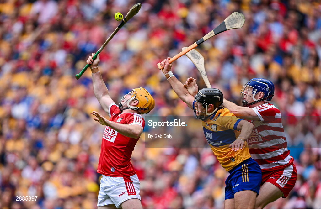 21 July 2024; David Reidy of Clare in action against Cork goalkeeper Patrick Collins, right, and Niall O'Leary during the GAA Hurling All-Ireland Senior Championship Final match between Clare and Cork at Croke Park in Dublin. Photo by Seb Daly/Sportsfile
