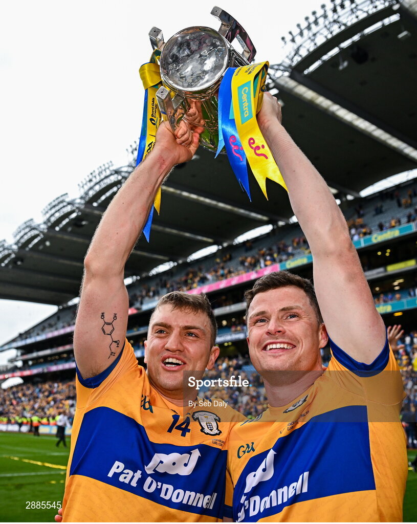 21 July 2024; Clare players Shane O'Donnell, left, and Paul Flanagan celebrate with the Liam MacCarthy Cup after their side's victory in the GAA Hurling All-Ireland Senior Championship Final match between Clare and Cork at Croke Park in Dublin. Photo by Seb Daly/Sportsfile