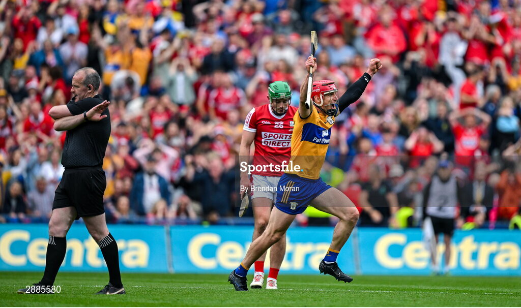 21 July 2024; John Conlon of Clare celebrates as Robbie O'Flynn of Cork looks dejected while referee Johnny Murphy blows the final whistle of the GAA Hurling All-Ireland Senior Championship Final between Clare and Cork at Croke Park in Dublin. Photo by Brendan Moran/Sportsfile