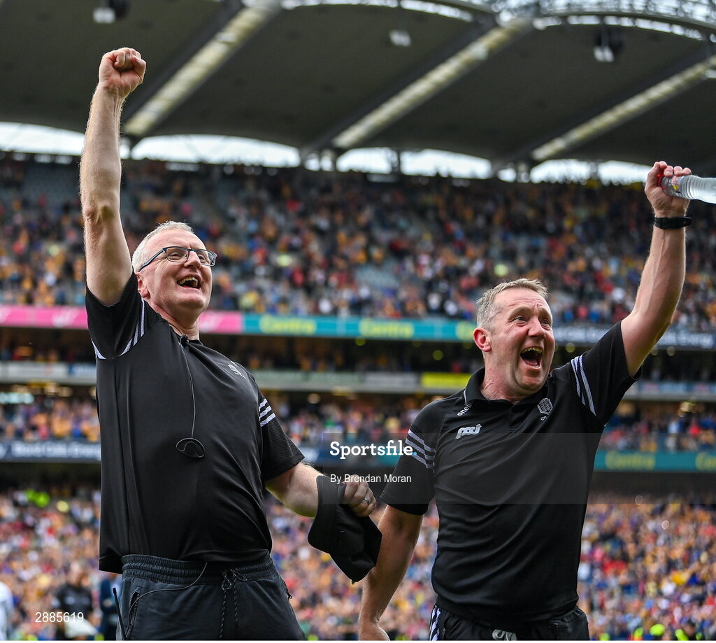 21 July 2024; Clare manager Brian Lohan and maor camán Brian McAllister, right, celebrate as his captain Tony Kelly lifts the Liam MacCarthy cup after the GAA Hurling All-Ireland Senior Championship Final between Clare and Cork at Croke Park in Dublin. Photo by Brendan Moran/Sportsfile