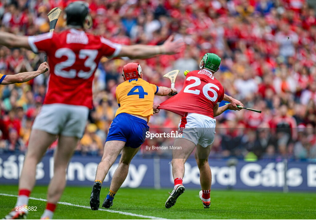 21 July 2024; Robbie O'Flynn of Cork has his jersey pulled by Conor Leen of Clare as he shoots for a score with the last shot in injury time during the GAA Hurling All-Ireland Senior Championship Final between Clare and Cork at Croke Park in Dublin. Photo by Brendan Moran/Sportsfile