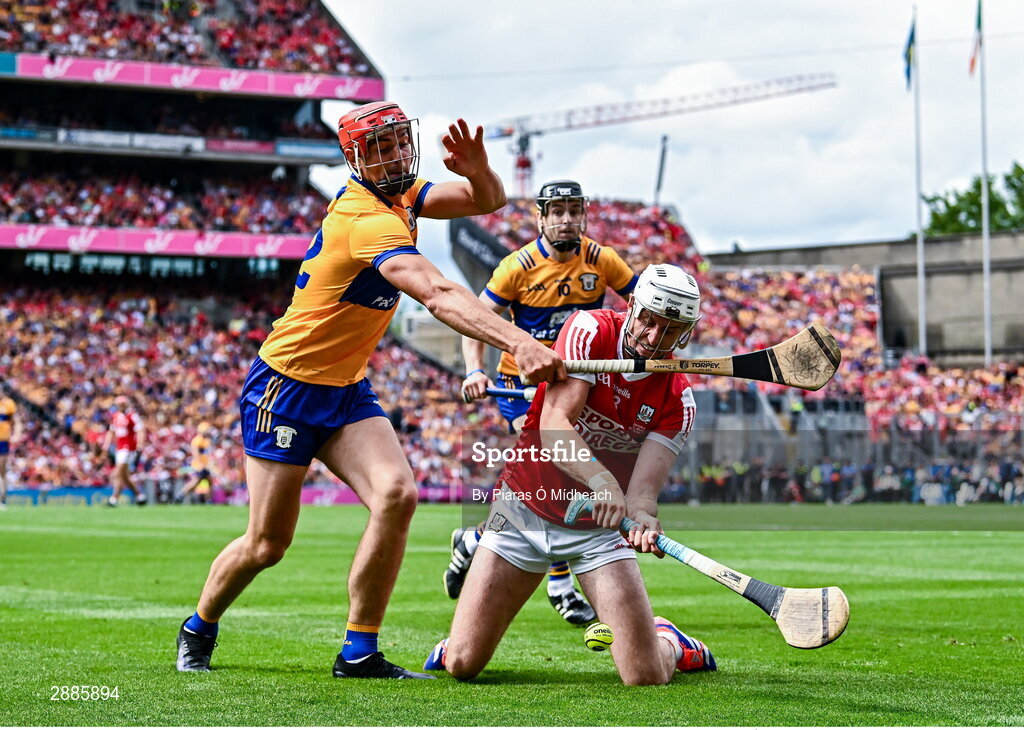 21 July 2024; Tim O'Mahony of Cork tries to clear under pressure from Peter Duggan of Clare during the GAA Hurling All-Ireland Senior Championship Final between Clare and Cork at Croke Park in Dublin. Photo by Piaras Ó Mídheach/Sportsfile