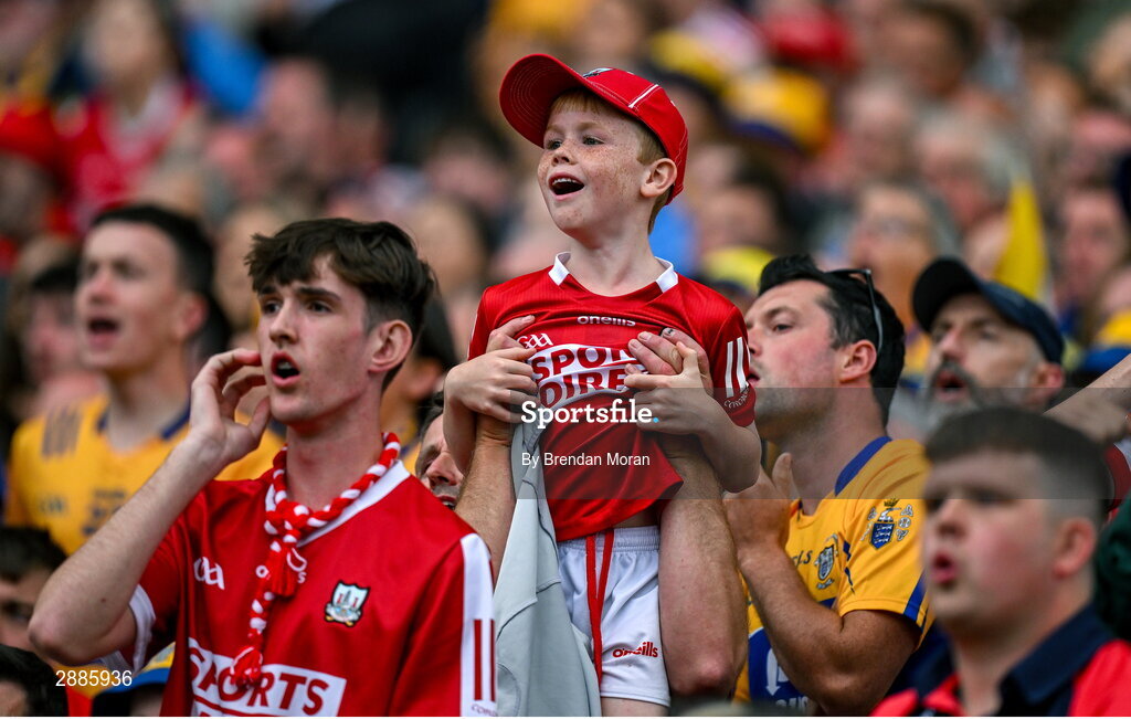 21 July 2024; Young Cork supporter Liam O'Donoghue is lifted by his father William to get a better view of the closing stages in extra time of the GAA Hurling All-Ireland Senior Championship Final between Clare and Cork at Croke Park in Dublin. Photo by Brendan Moran/Sportsfile