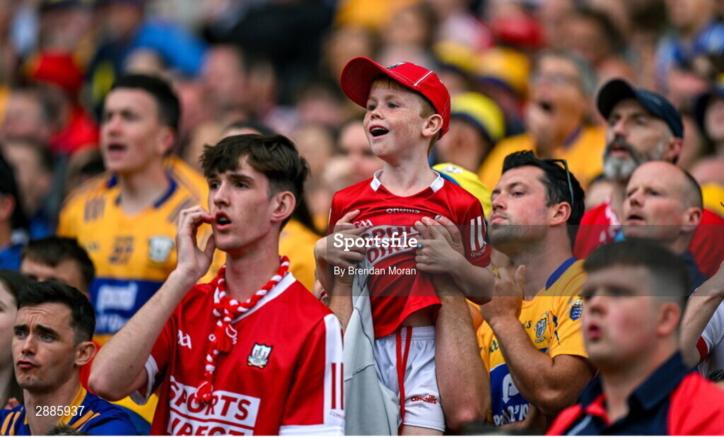 21 July 2024; Young Cork supporter Liam O'Donoghue is lifted by his father William to get a better view of the closing stages in extra time of the GAA Hurling All-Ireland Senior Championship Final between Clare and Cork at Croke Park in Dublin. Photo by Brendan Moran/Sportsfile