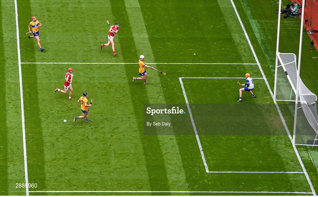 21 July 2024; Robert Downey of Cork, top, scores his side's first goal, past Clare goalkeeper Eibhear Quilligan, during the GAA Hurling All-Ireland Senior Championship Final match between Clare and Cork at Croke Park in Dublin. Photo by Seb Daly/Sportsfile